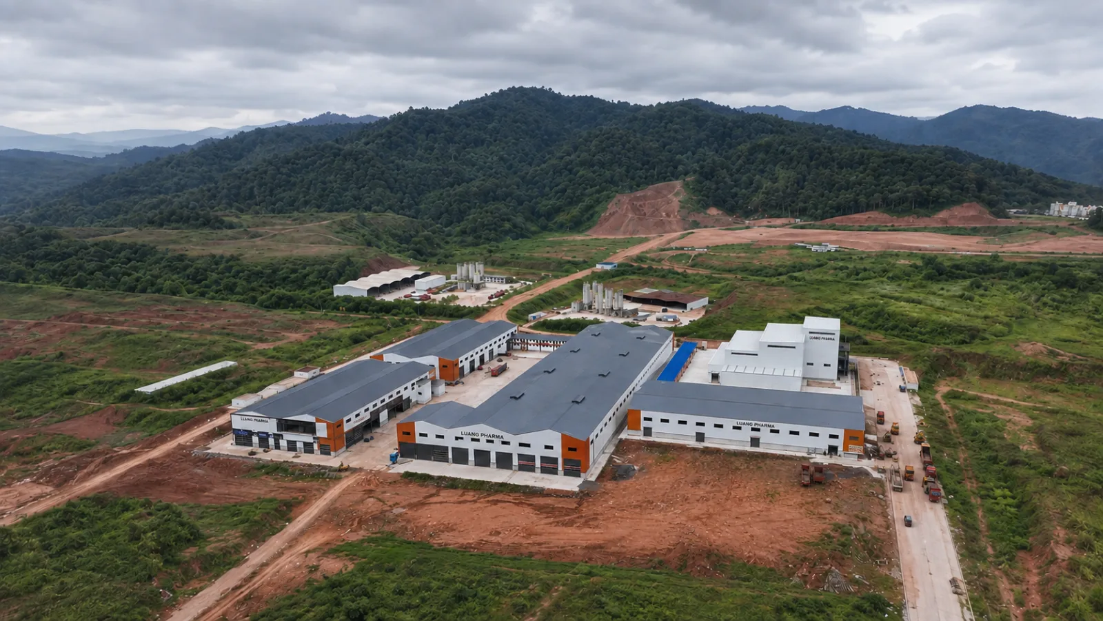The Luang Pharma buildings against the hills of the Boten zone