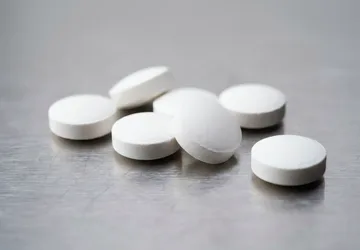 Illustrative unbranded uncoated tablet detail.